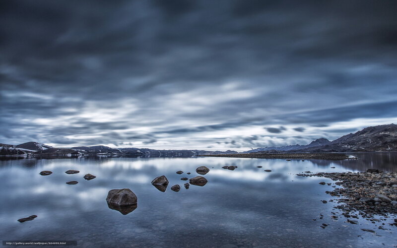 Stormy lake with mountain reflections