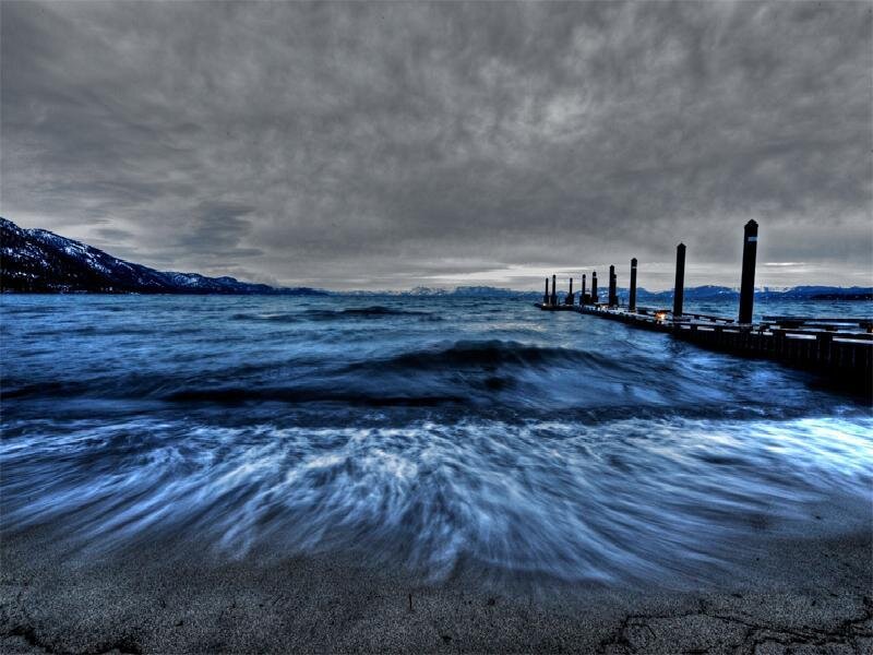 Stormy lake with pier