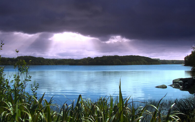 Stormy lake with sunbeams