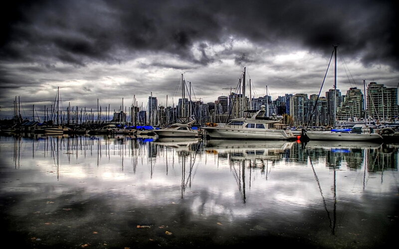 Stormy marina with city skyline
