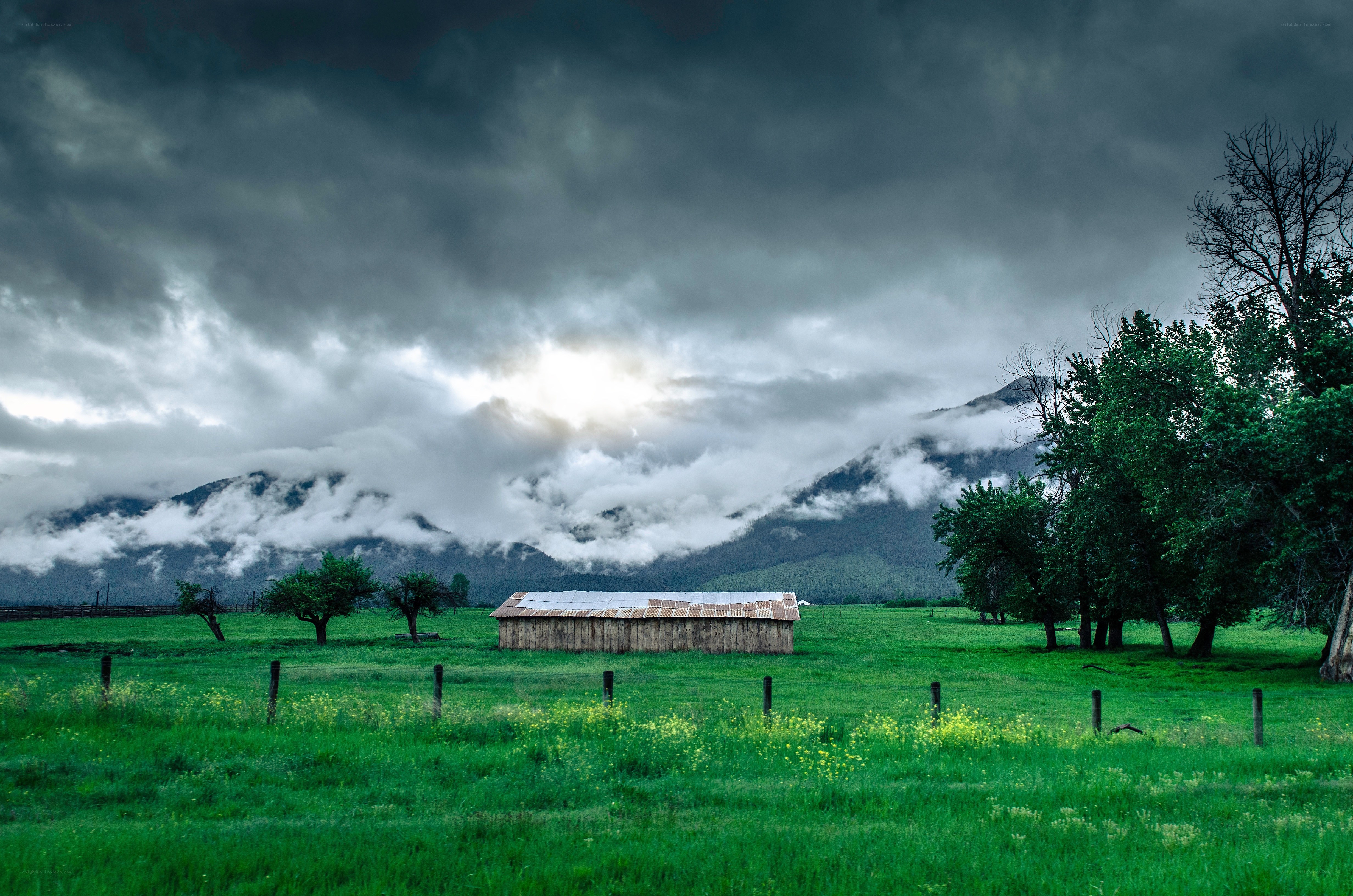 Stormy mountain farm scene