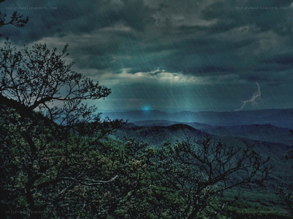 Stormy mountain landscape at night