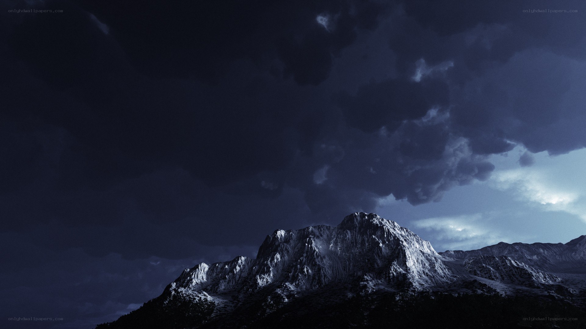 Stormy mountain peak at night
