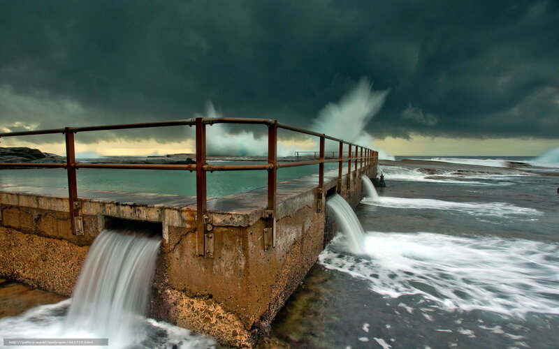 Stormy ocean pool at sunset