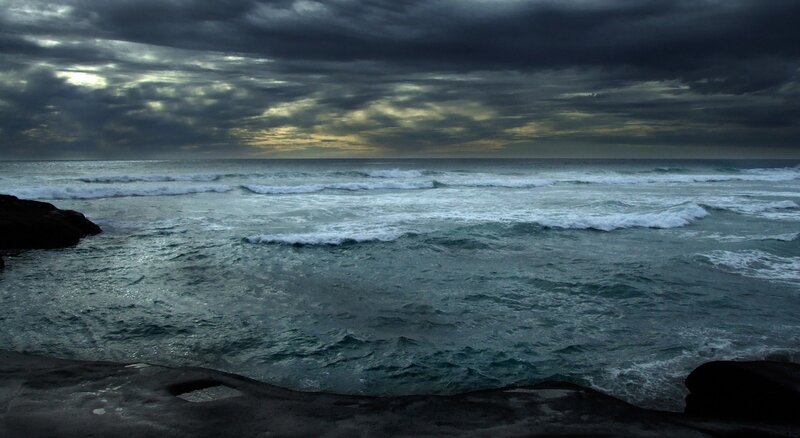 Stormy ocean waves at dusk