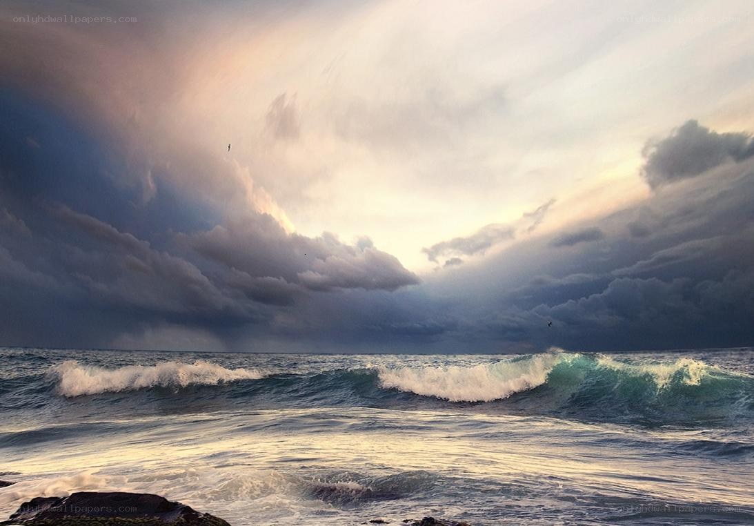 Stormy ocean waves at sunset