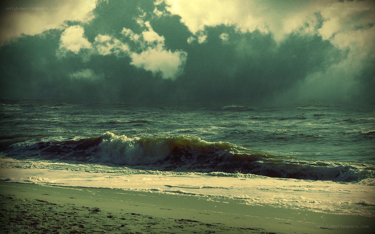 Stormy ocean waves at sunset