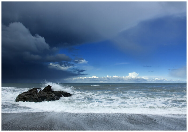 Stormy ocean with rocky shore