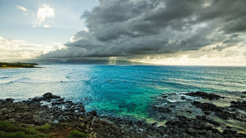 Stormy ocean with surfers