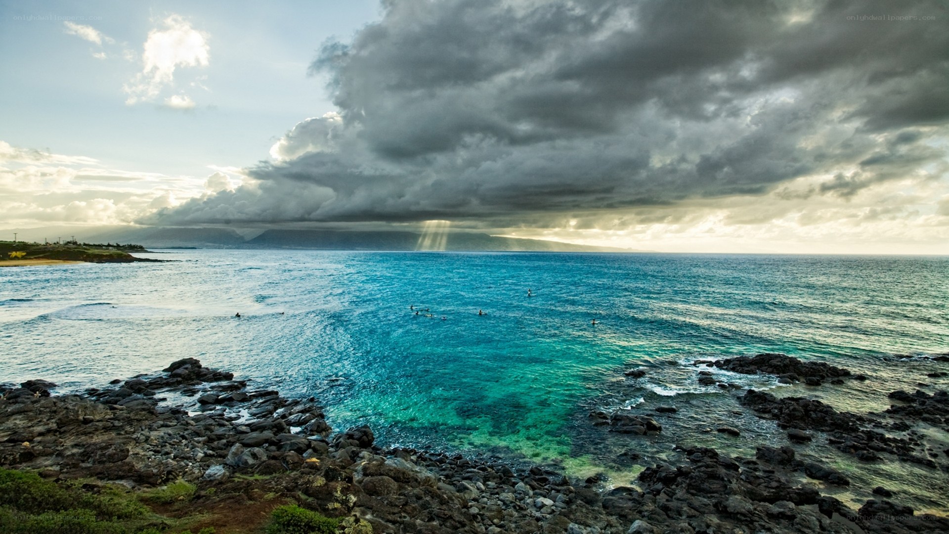 Stormy ocean with surfers