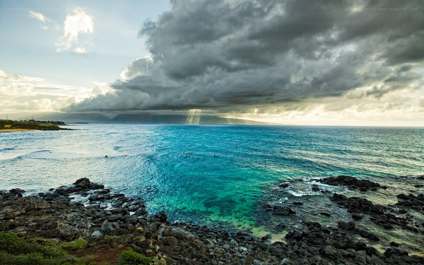 Stormy ocean with surfers