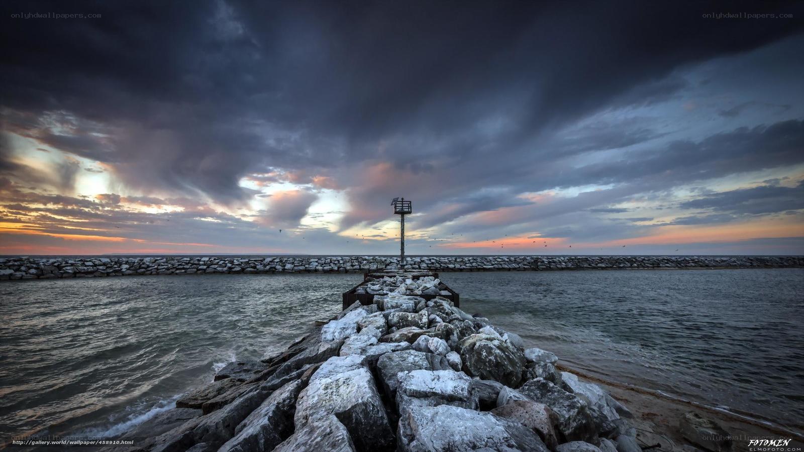 Stormy pier at sunset