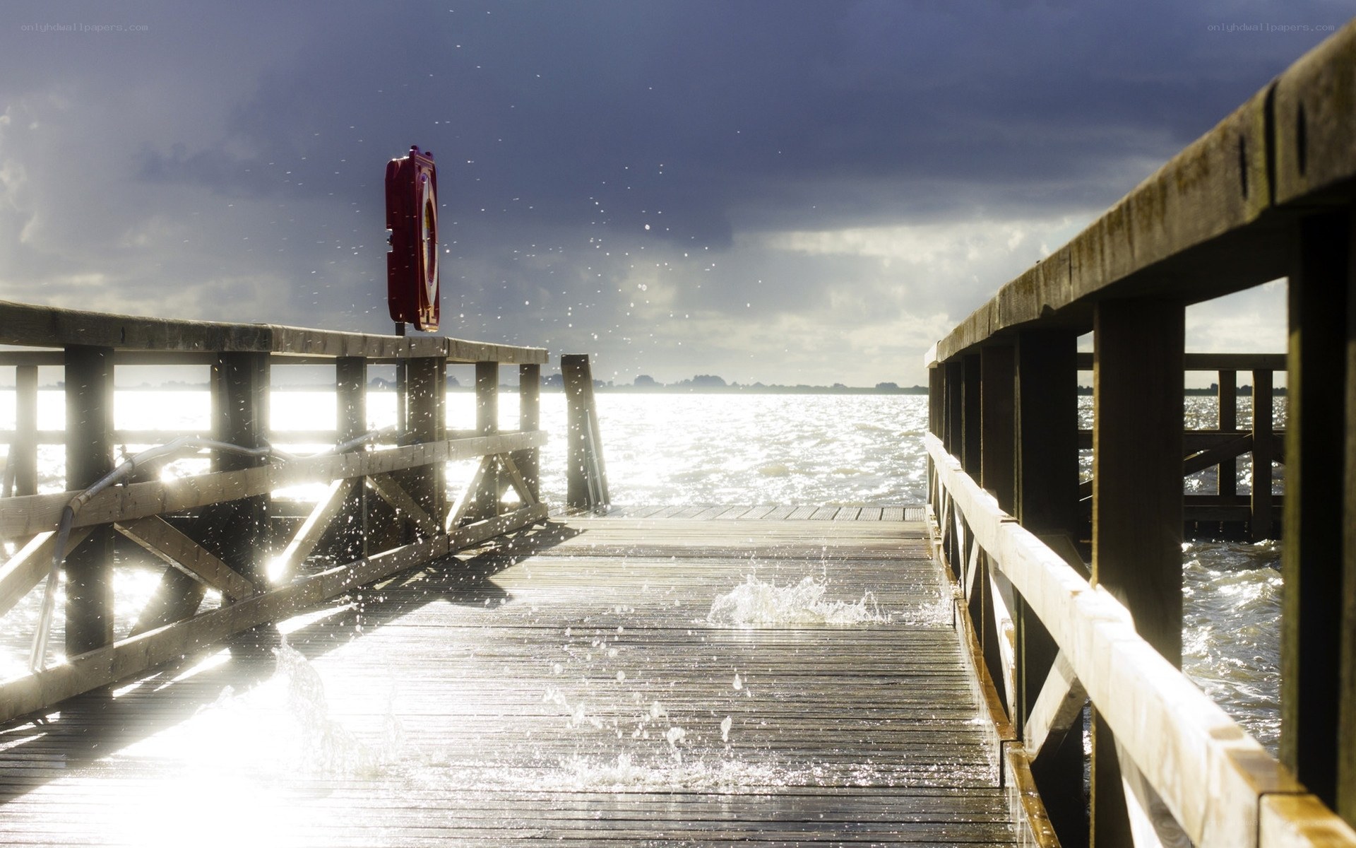 Stormy pier with splashing water
