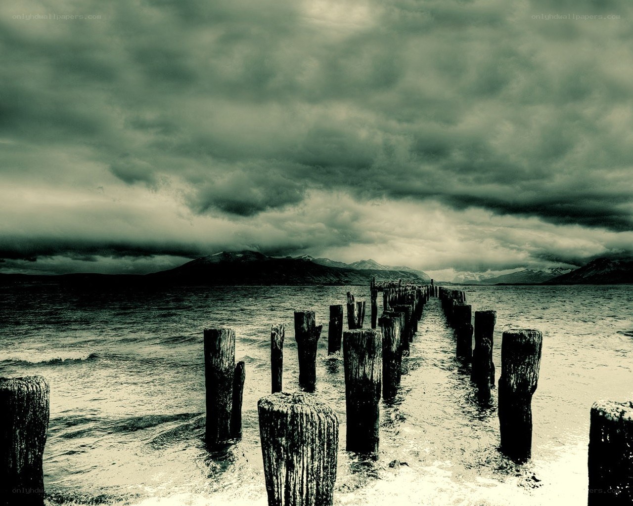 Stormy pier with wooden posts