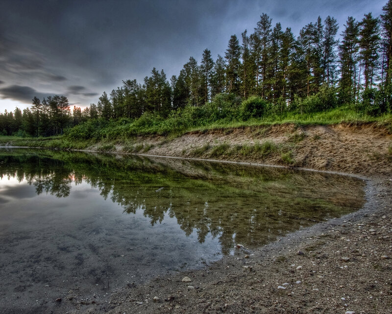 Stormy river reflection