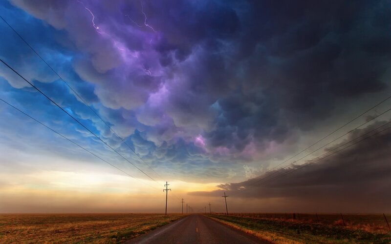 Stormy road at sunset