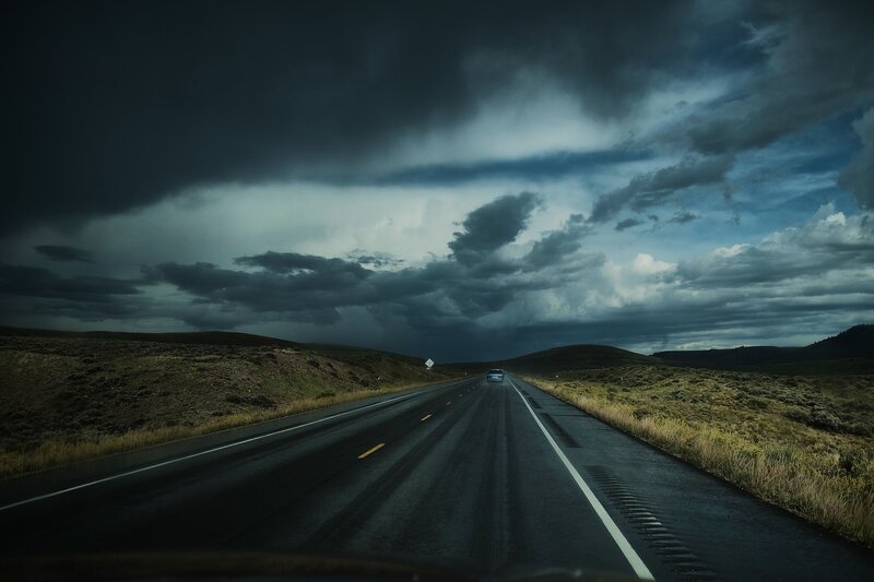 Stormy road under dark clouds