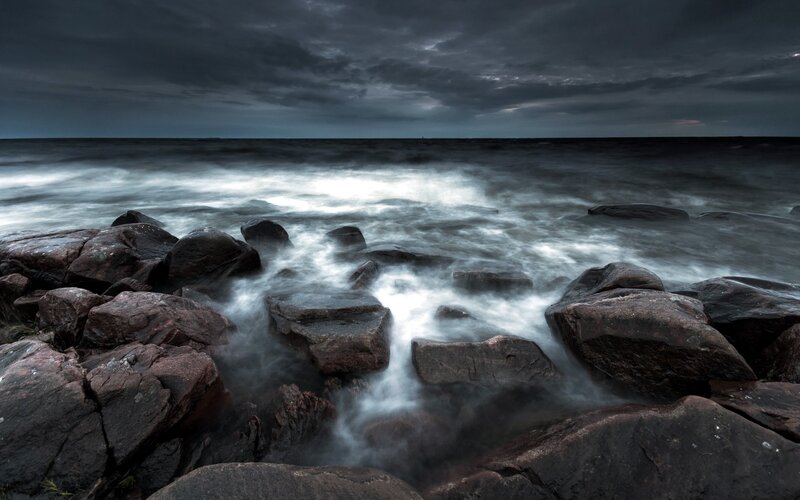 Stormy sea at rocky shore