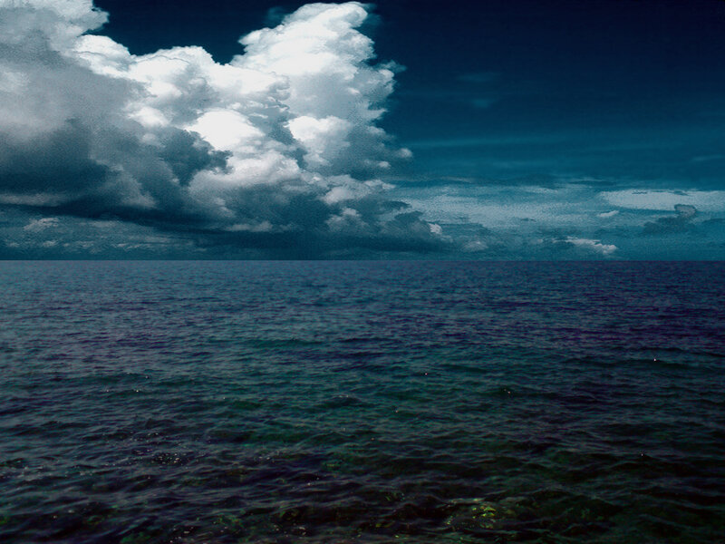 Stormy sea under cloudy sky