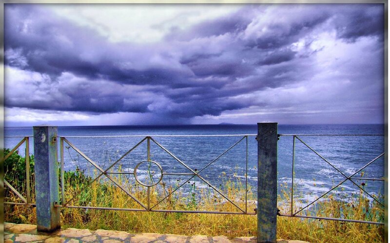 Stormy sea view from a fence