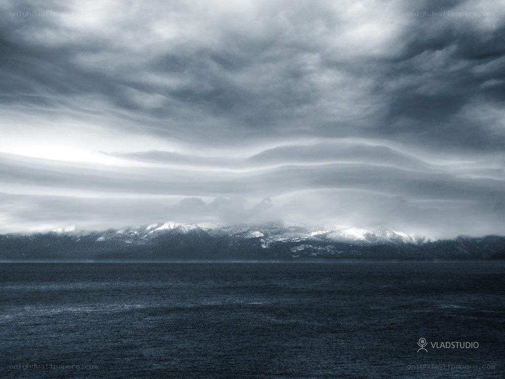 Stormy sea with distant mountains
