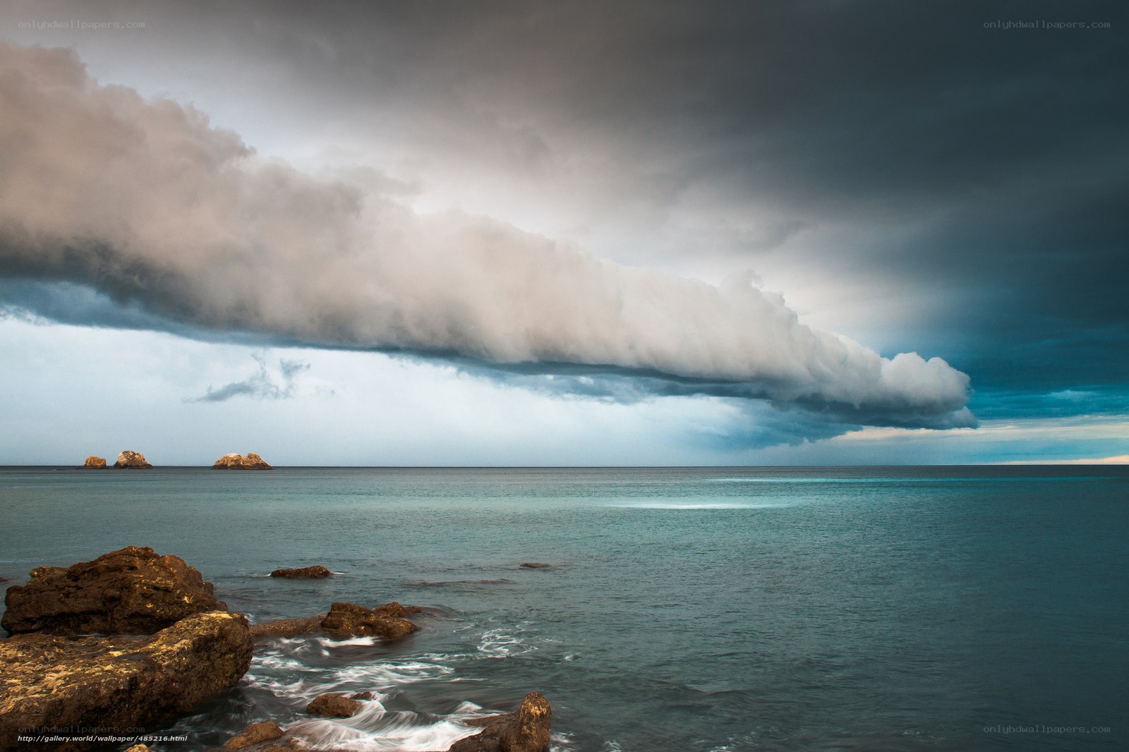 Stormy sea with rocky shore