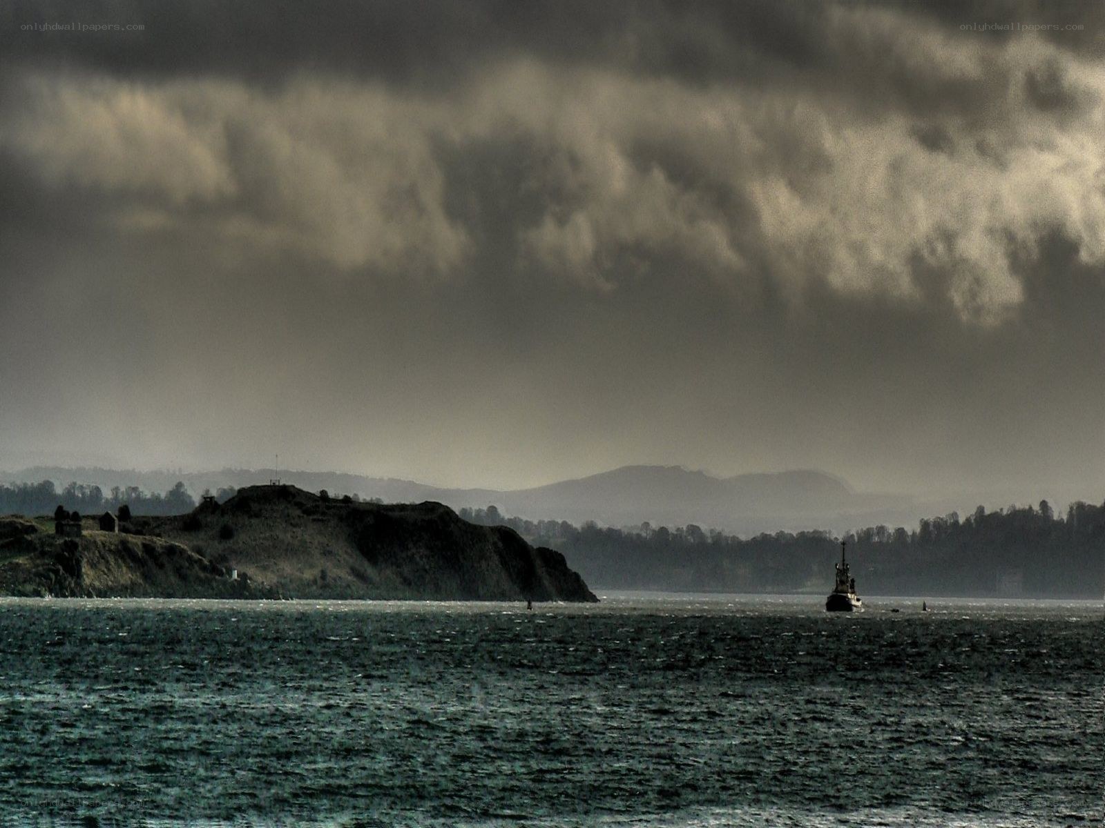 Stormy sea with ship and cliffs
