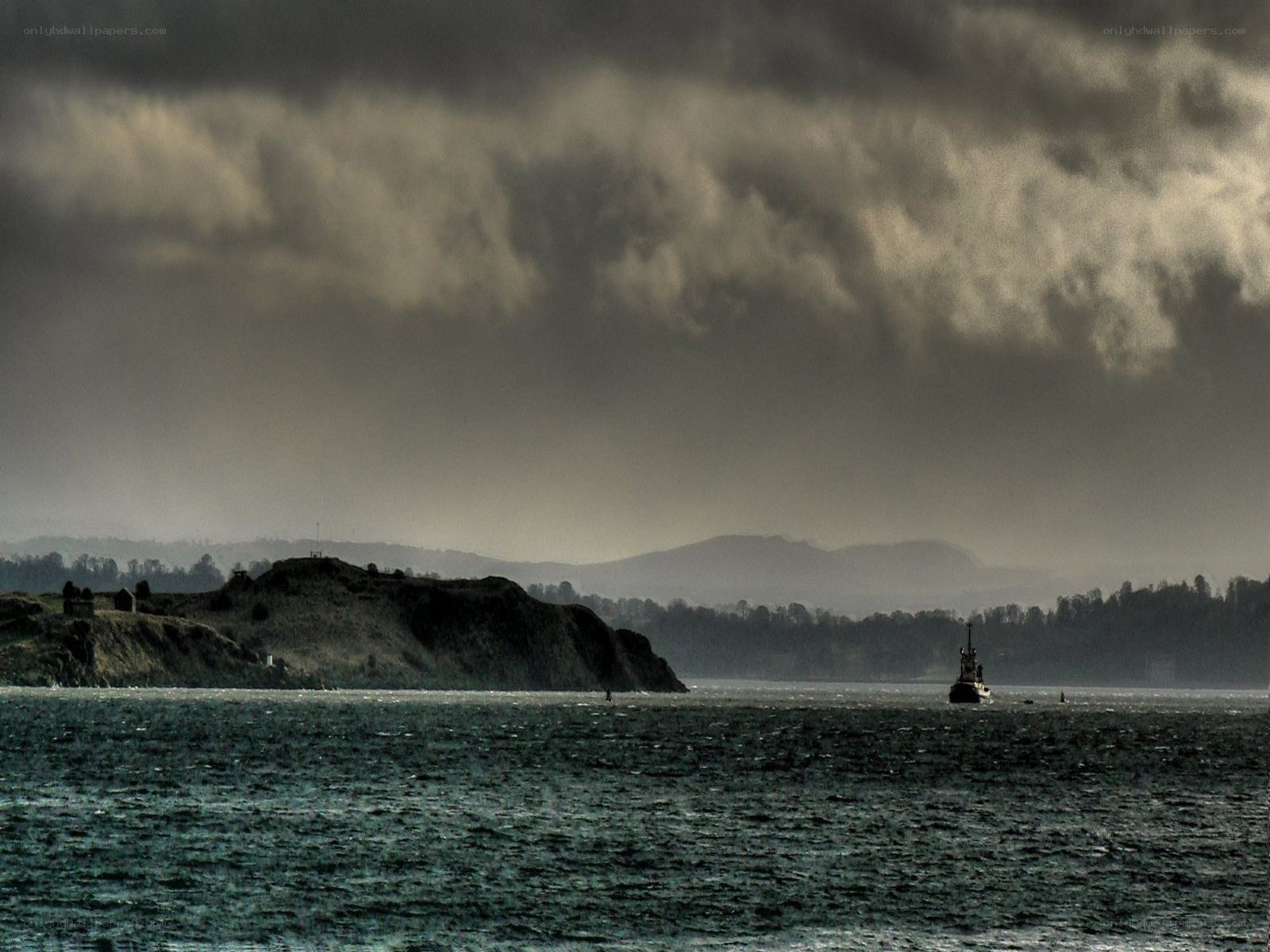 Stormy sea with ship and cliffs