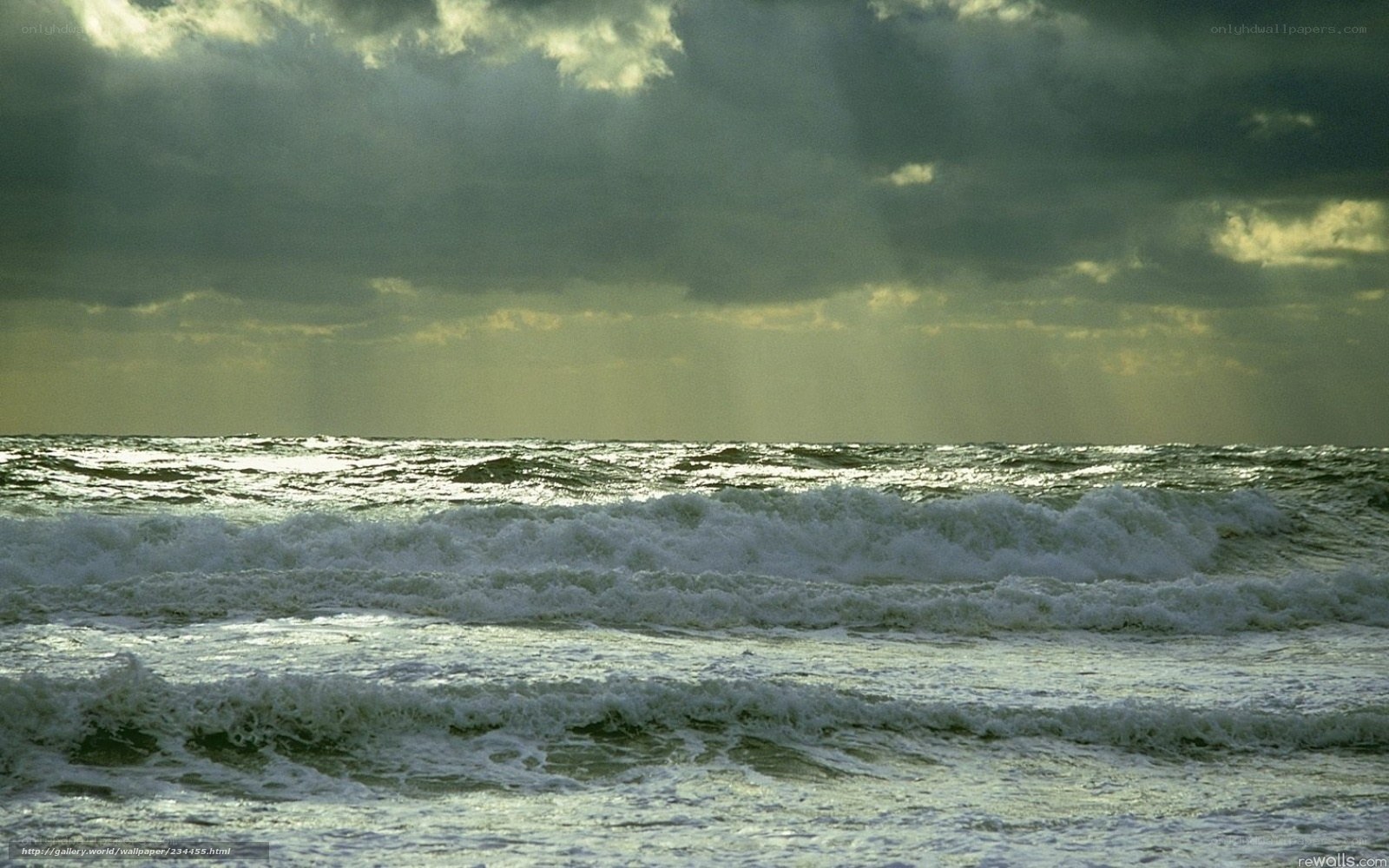 Stormy sea with sunbeams
