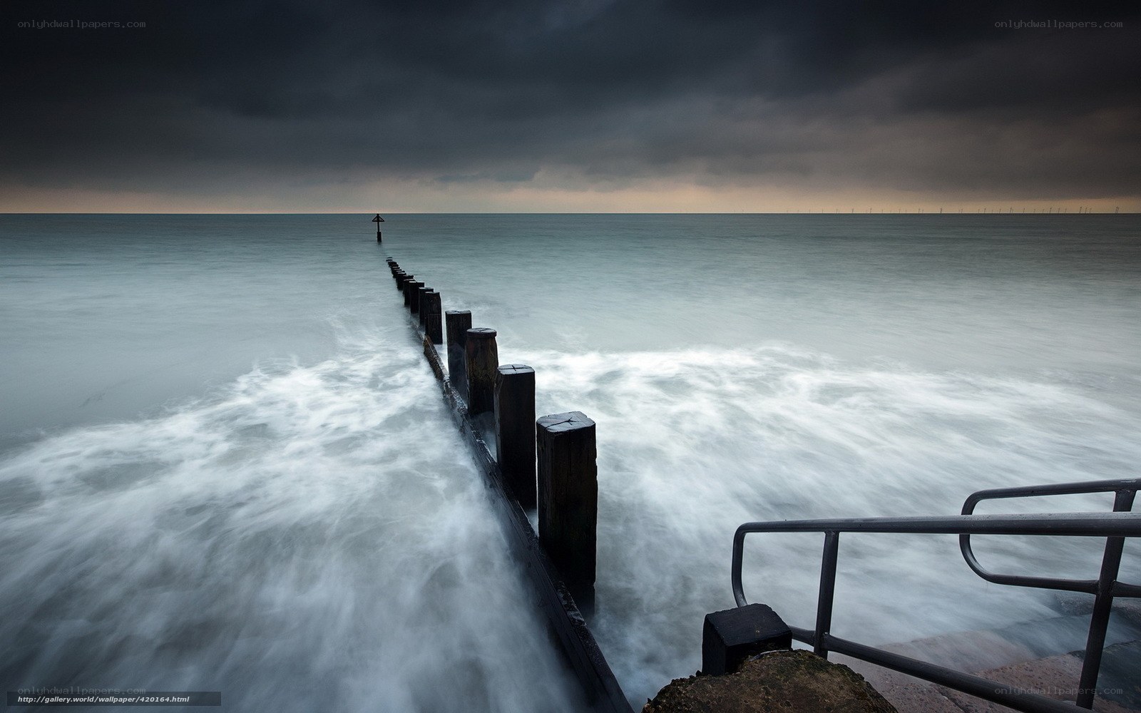 Stormy sea with wooden groynes