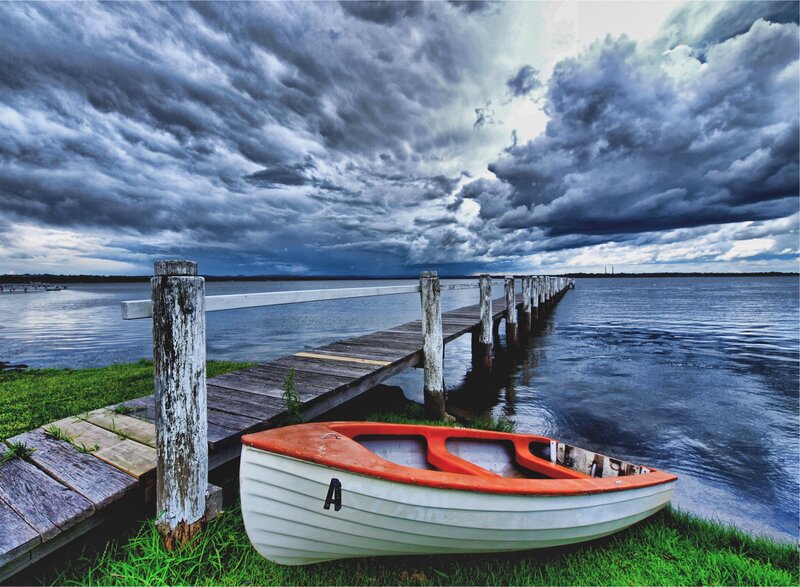Stormy sky over a dock and boat