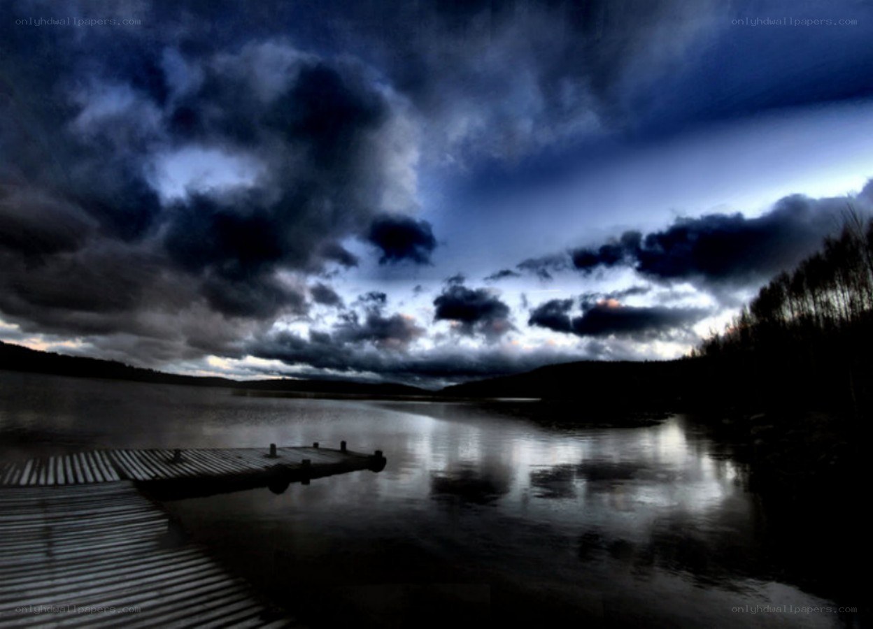 Stormy sky over a lake dock