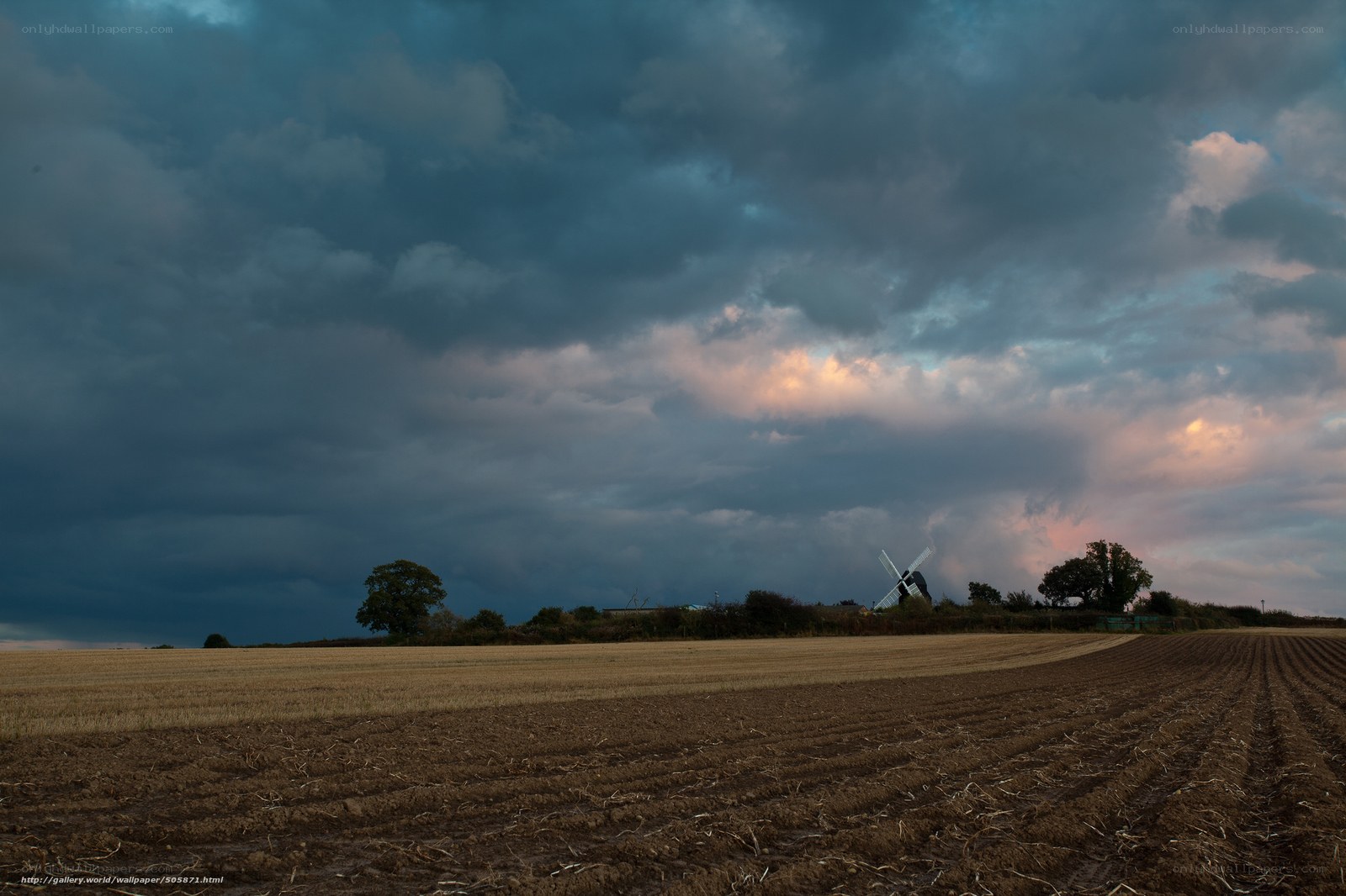 Stormy sky over a windmill