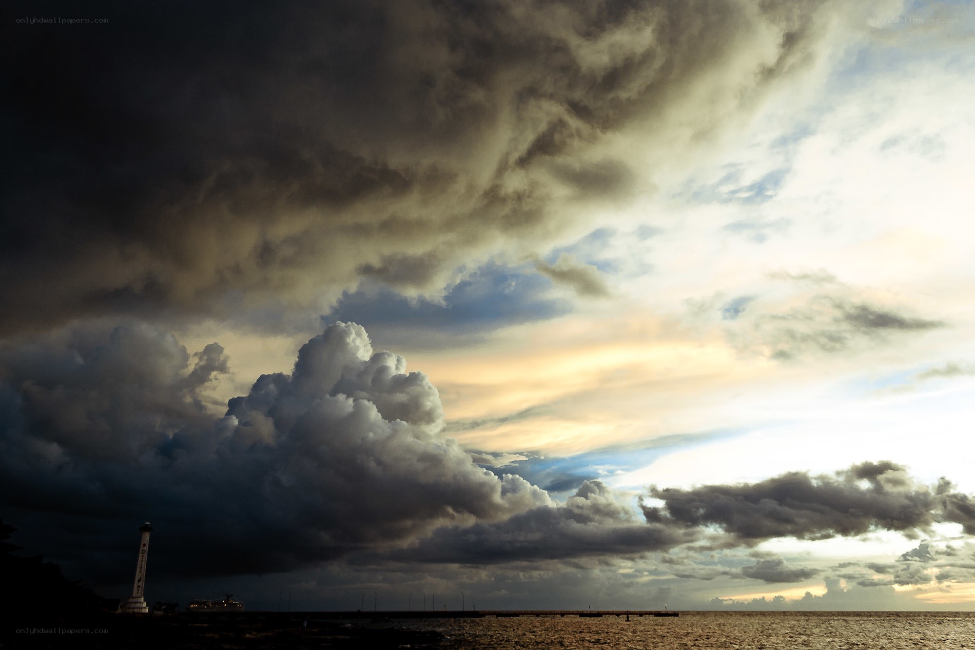 Stormy sky over coastal lighthouse
