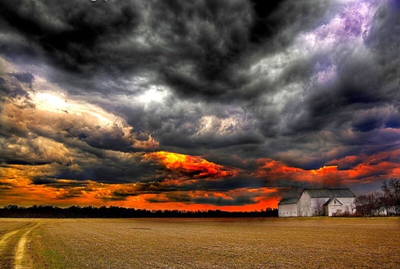 Stormy sky over farm field