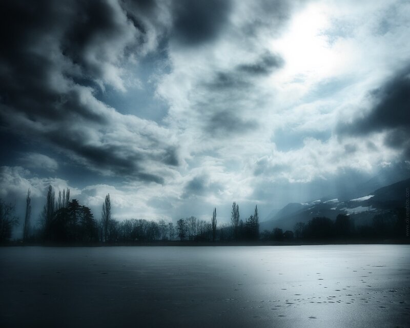 Stormy sky over frozen lake