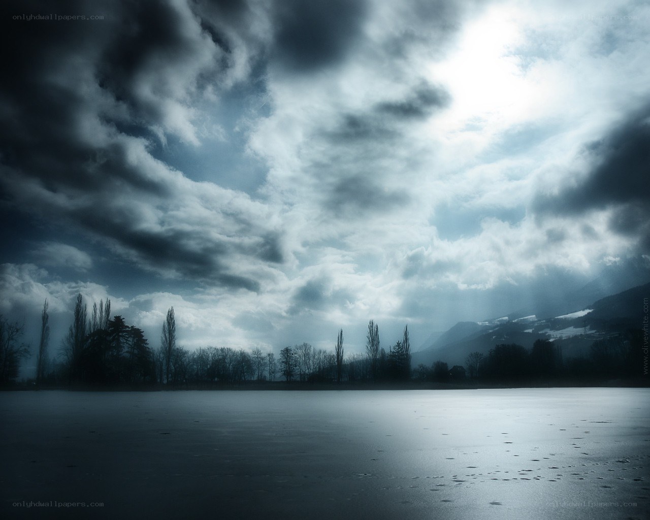 Stormy sky over frozen lake