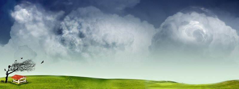 Stormy sky over green hills