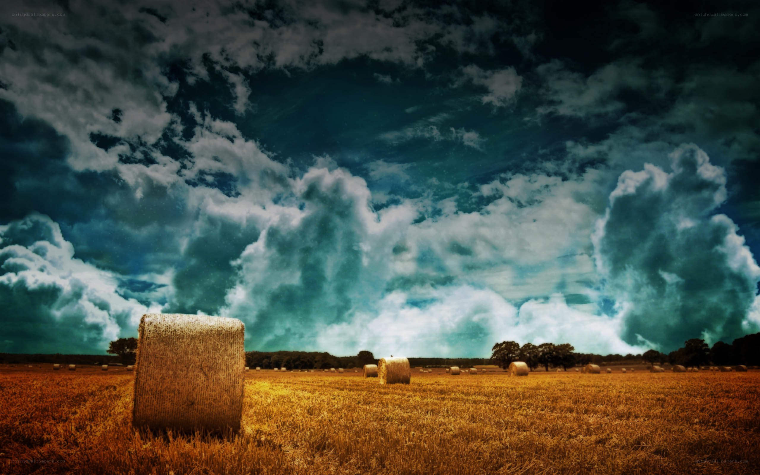 Stormy sky over hay bales