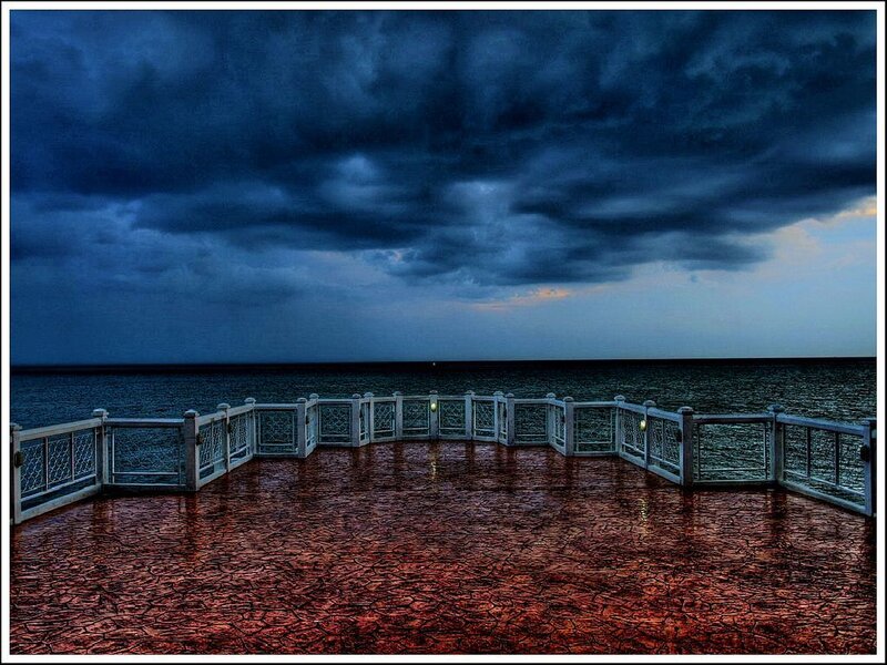Stormy sky over ocean pier