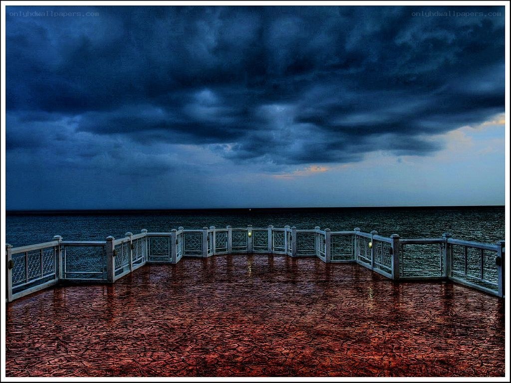 Stormy sky over ocean pier