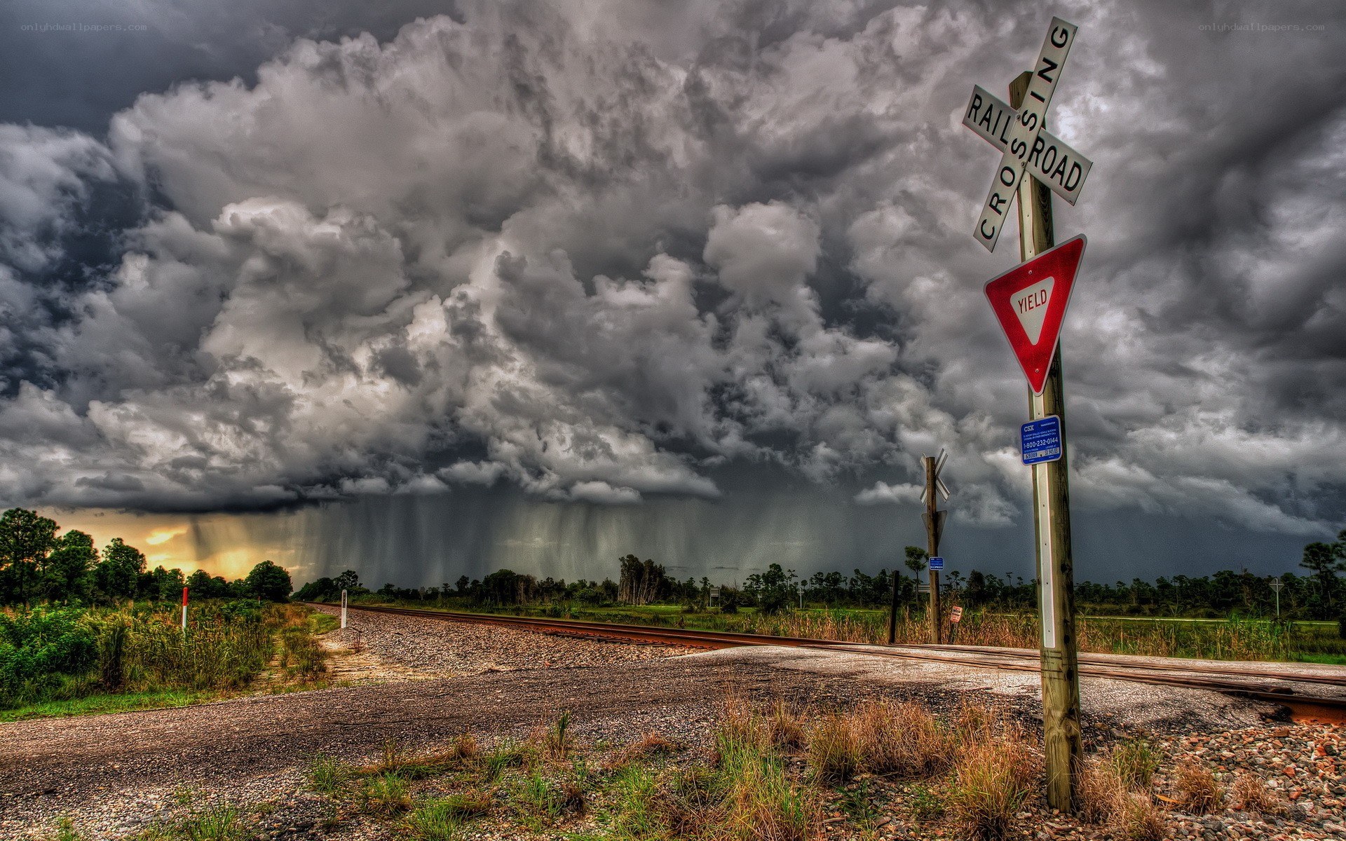 Stormy sky over railroad crossing