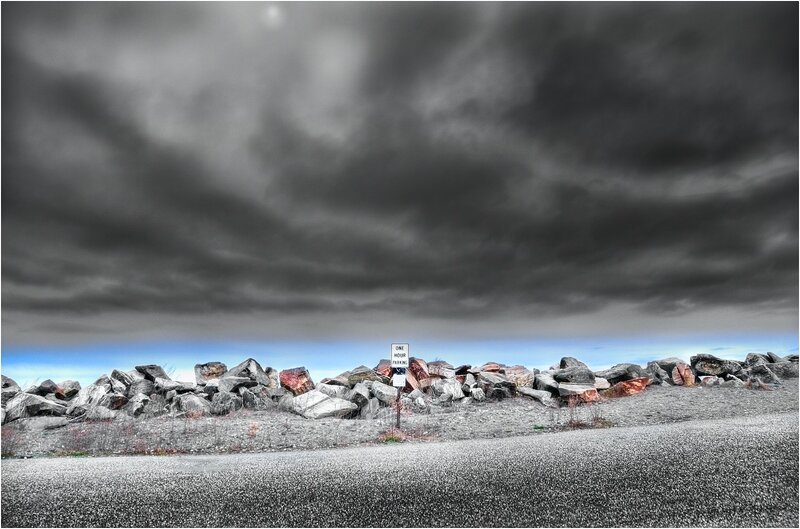 Stormy sky over rocky shore