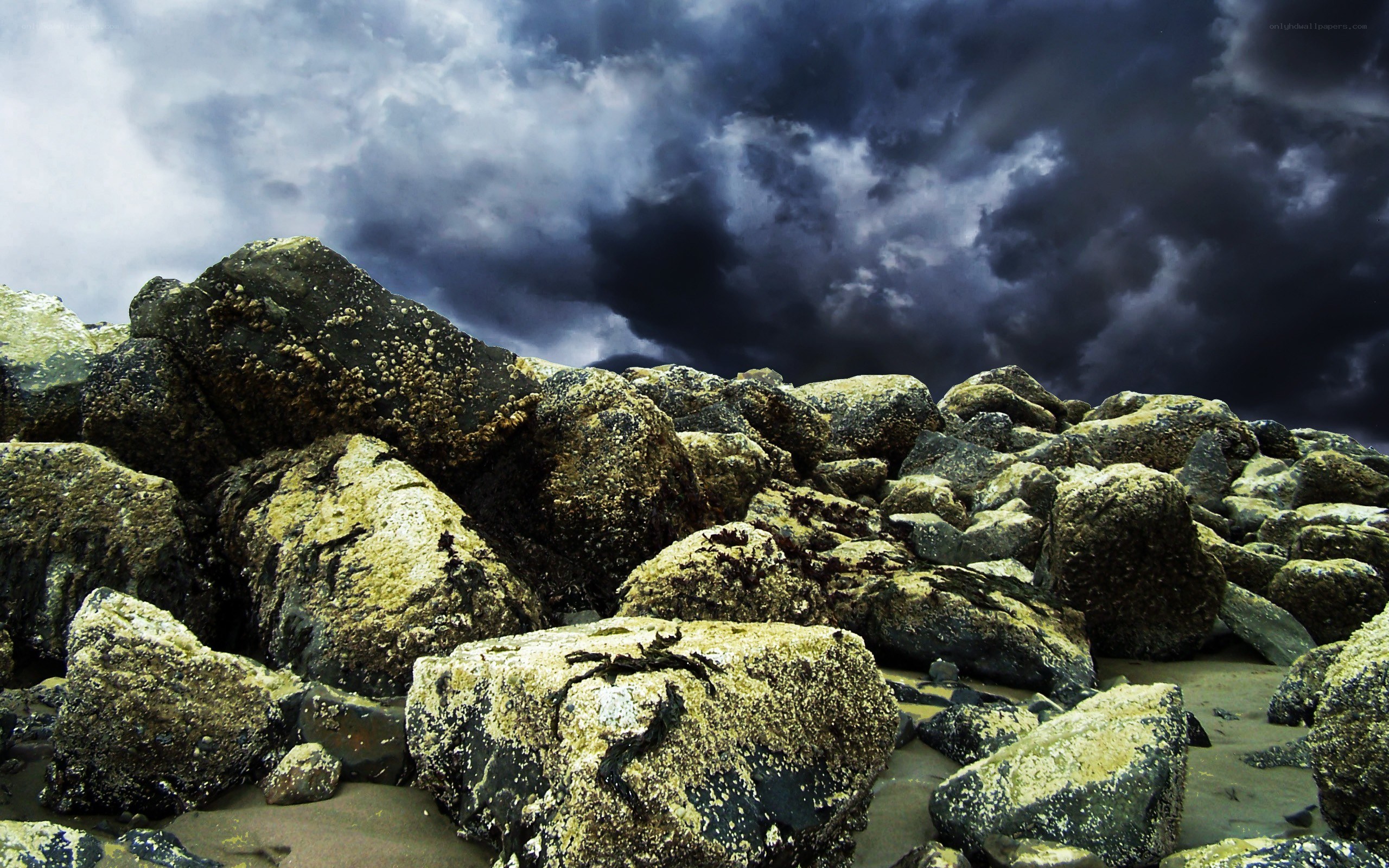 Stormy sky over rocky shore