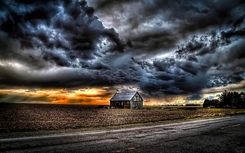 Stormy sky over rural barn