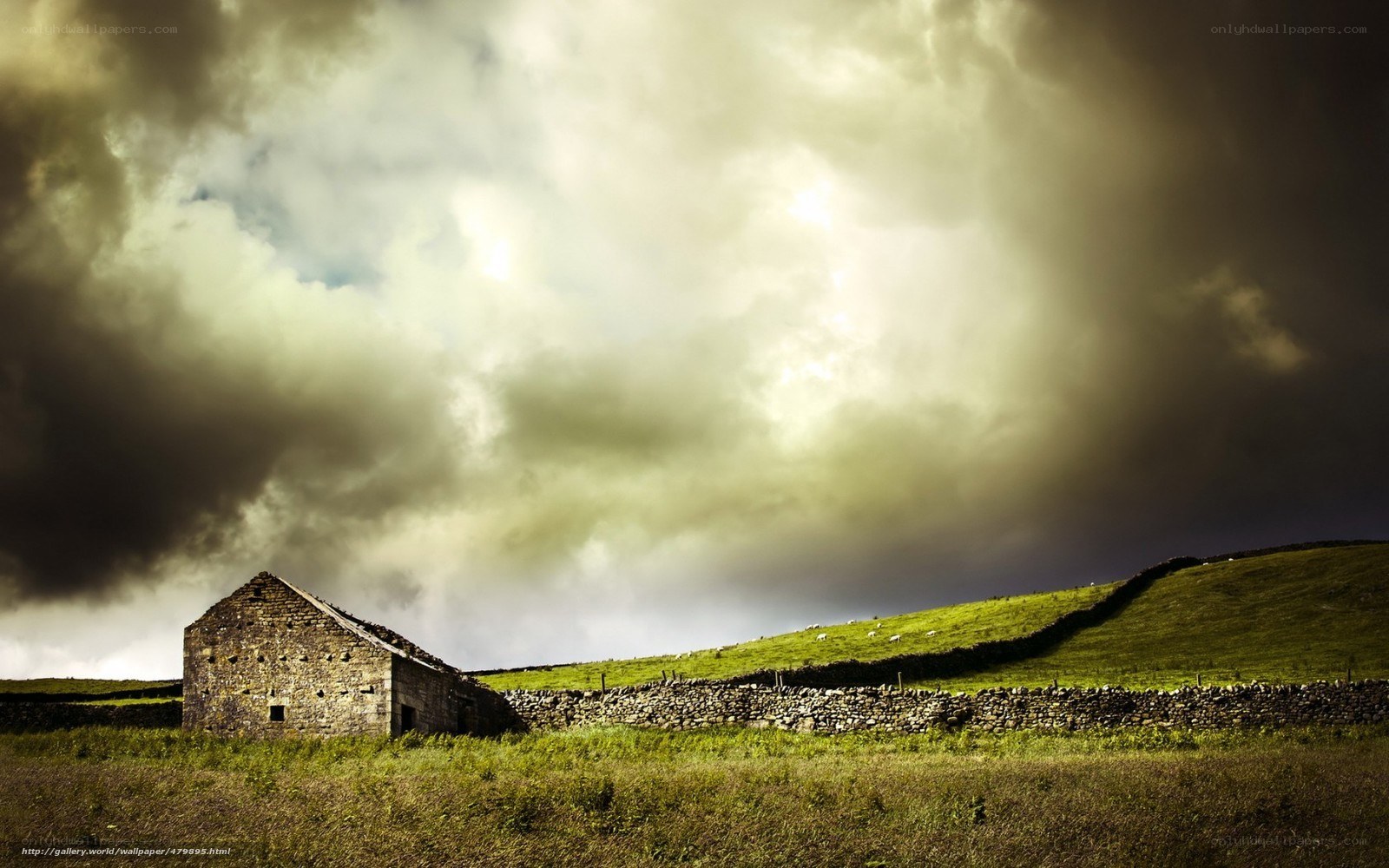 Stormy sky over stone barn