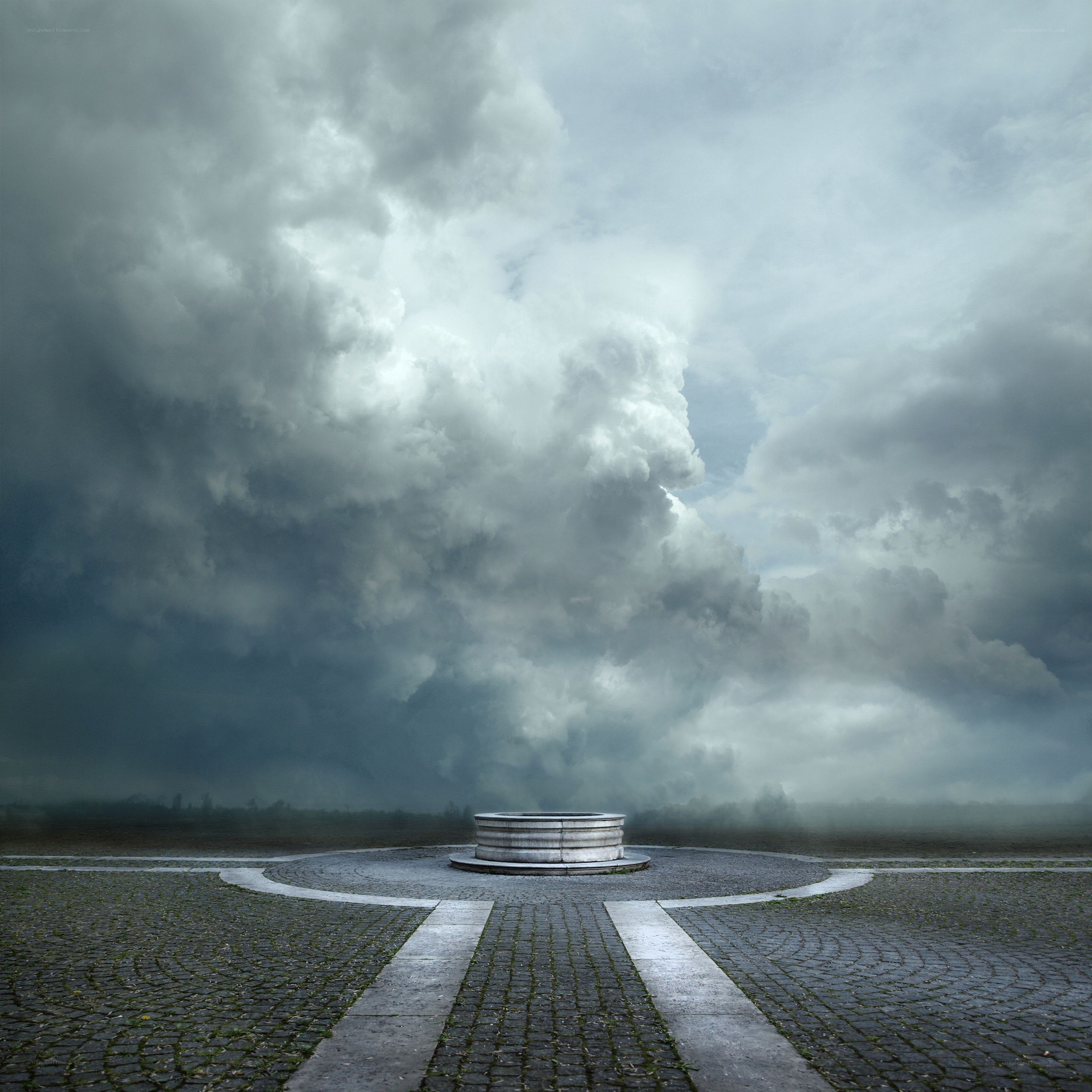 Stormy sky over stone well