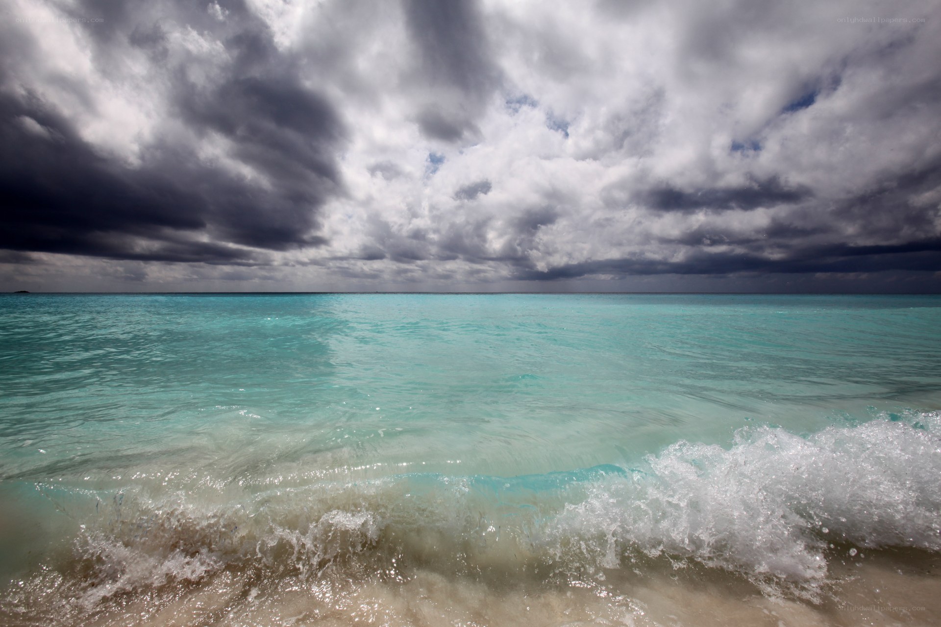 Stormy sky over turquoise sea