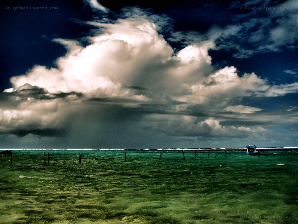 Stormy sky over turquoise sea