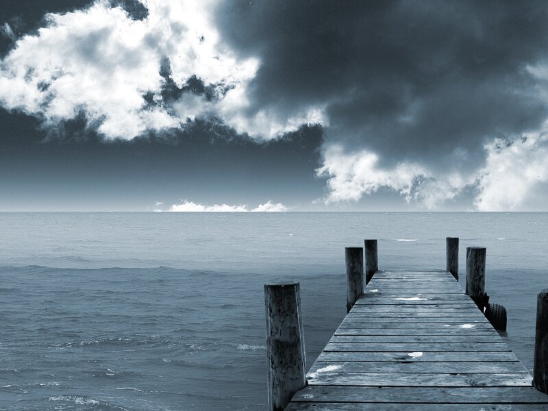 Stormy sky over wooden pier